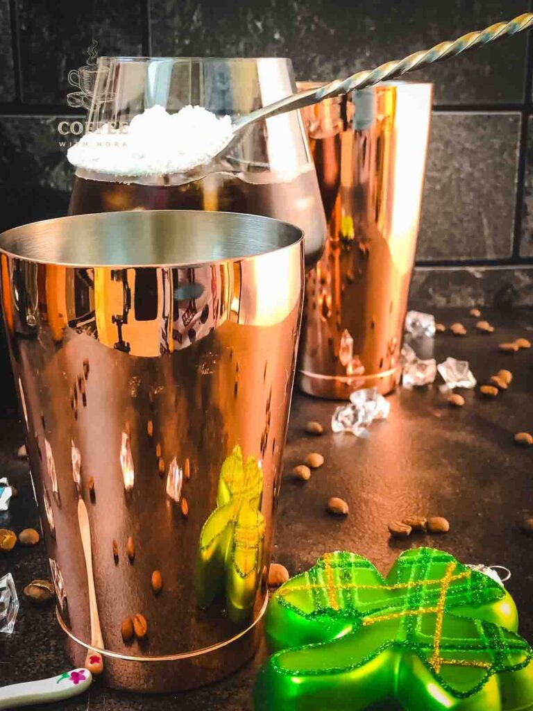 Add powdered sugar to a cocktail shakers tin.