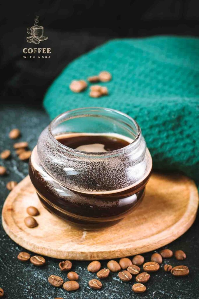 Gorgeous glass, filled with an hot Americano coffee.